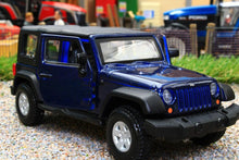 Load image into Gallery viewer, BUR43012B BURAGO 132 SCALE JEEP WRANGLER RUBICON 2010 IN DARK BLUE