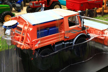 Load image into Gallery viewer, SCH07724 SCHUCO MERCEDES BENZ UNIMOG WITH SNOW PLOUGH AND SALT SPREADER - WINTER WEATHERED