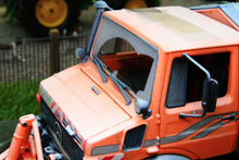 Load image into Gallery viewer, SCH07724 SCHUCO MERCEDES BENZ UNIMOG WITH SNOW PLOUGH AND SALT SPREADER - WINTER WEATHERED