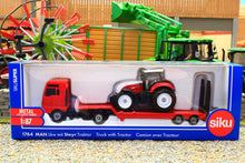 Load image into Gallery viewer, 1764 Siku Small Scale MAN low loader lorry with Steyr tractor