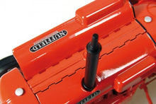 Load image into Gallery viewer, Close up of a red Nuffield Universal tractor model showing the bonnet and exhaust pipe with detailed branding from Universal Hobbies