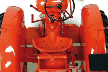 Load image into Gallery viewer, Close-up of a red Nuffield Universal 4 tractor model with detailed seat steering wheel and controls by Universal Hobbies in 1:16 scale