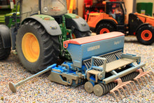 Load image into Gallery viewer, Weathered Siku Lemken Saphir 7 seed drill in blue and grey with detailed rollers and tines beside a green tractor in a 1:32 scale farm diorama