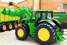 Load image into Gallery viewer, Siku John Deere 6M 220 green tractor with yellow wheels and front loader, a 1:32 scale farm model displayed beside a trailer outdoors
