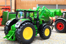 Load image into Gallery viewer, Siku John Deere 6M 220 1:32 scale tractor model with detachable front loader and green bucket, displayed in a farm setting