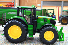 Load image into Gallery viewer, Siku 1:32 scale John Deere tractor model in green with yellow wheels and detachable front loader, displayed on a miniature farm scene