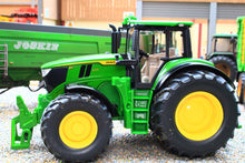 Load image into Gallery viewer, Siku John Deere 6M 220 green and yellow diecast tractor with front loader, shown in a farm setting as a 1:32 scale model્રીય