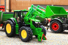 Load image into Gallery viewer, Siku John Deere 6M tractor model with detachable front loader and raised bucket, shown as a 1:32 scale farm toy on display