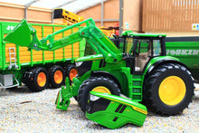 Load image into Gallery viewer, Siku John Deere 6M 220 tractor with front loader and detached loader attachment beside a green farm trailer in a realistic farmyard scene 1:32 scale model