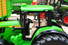 Load image into Gallery viewer, Siku John Deere 6M 220 toy tractor in green with enclosed cab black tyres and front loader detail shown as a 1:32 scale farm model