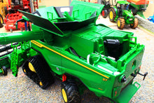 Load image into Gallery viewer, Britains John Deere S7 900 tracked combine harvester model in green and yellow with detailed tracks grain tank and unloading auger on display