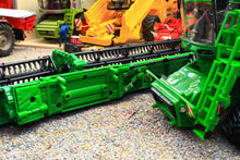 Load image into Gallery viewer, Britains John Deere S7 900 tracked combine harvester model showing its green cab and detailed cutting header among miniature farm machinery