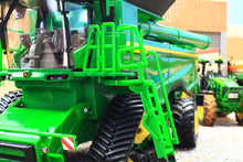 Load image into Gallery viewer, Britains John Deere S7 900 tracked combine harvester model in green with ladder and harvesting equipment visible in close up