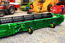 Load image into Gallery viewer, Britains 1:32 scale green combine harvester header displayed in a detailed farm diorama with tractors and agricultural machinery in the background