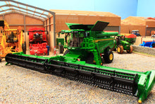 Load image into Gallery viewer, Britains John Deere combine harvester model with a wide cutting header displayed among farm buildings and other agricultural machinery in a detailed farm layout