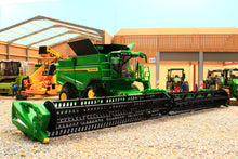 Load image into Gallery viewer, Britains John Deere S7 900 combine harvester model with a wide cutting header displayed at a farm machinery show with other agricultural models
