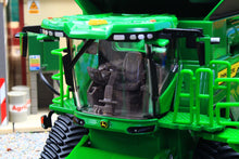 Load image into Gallery viewer, Britains John Deere S7 900 tracked combine harvester model showing the detailed cab seat controls and green agricultural machinery body
