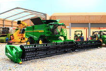 Load image into Gallery viewer, Britains John Deere S7 900 tracked combine harvester model with wide cutting header displayed in a farm machinery yard diorama perfect for collectors and farm playsets