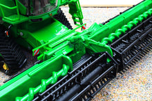 Load image into Gallery viewer, Close up of a green Britains John Deere tracked combine harvester model with detailed cutting header and black tracks on a gravel surface