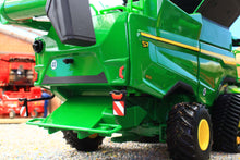Load image into Gallery viewer, Britains John Deere S7 900 combine harvester model shown in close view with green body yellow wheels rear discharge area and detailed farm machinery parts