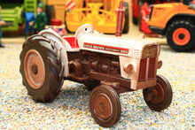 Load image into Gallery viewer, Weathered Britains David Brown 990 2WD tractor model in 1:32 scale displayed on a farm diorama with authentic aged detailing
