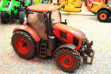 Load image into Gallery viewer, Weathered red Kubota M7.154 4WD tractor model by Britains in 1:32 scale with enclosed cab large treaded tyres and front hitch linkage