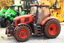 Load image into Gallery viewer, Weathered Britains Kubota M7.154 4WD tractor model in orange with red wheels displayed on gravel in a farm diorama 1:32 scale collectible model tractor