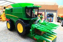 Load image into Gallery viewer, Britains John Deere combine harvester toy with green body and yellow wheels displayed with a front header in a farm diorama for children aged 3 and over