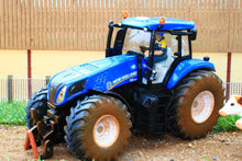 Load image into Gallery viewer, 8607 SIKU MUDDY NEW HOLLAND TRACTOR WITH IFOR WILLIAMS STOCK TRAILER AND 2 COWS