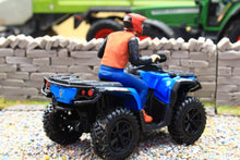 Load image into Gallery viewer, Diecast Masters 1 32 scale blue quad bike with a rider wearing a red helmet and orange vest on a gravel farm diorama beside a stone wall