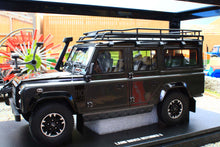 Load image into Gallery viewer, GT Spirit Models 1:18 scale Land Rover Defender 110 SW Adventure Edition in Corris Grey with roof rack displayed on a model stand