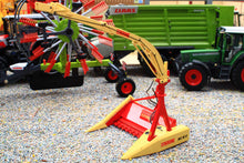 Load image into Gallery viewer, Marge Models 1:32 scale Krone agricultural implement in red and yellow displayed with model tractors and diecast farm machinery in a farm diorama