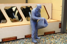 Load image into Gallery viewer, PYO755 Man Emptying a Stock Feed Sack