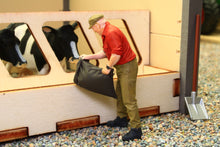 Load image into Gallery viewer, PYO755 Man Emptying a Stock Feed Sack