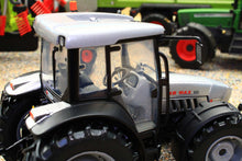 Load image into Gallery viewer, ROS 1:32 scale model tractor in silver and black with enclosed cab and detailed wheels shown in close up for collectors and farm layouts