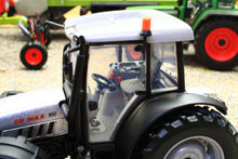 Load image into Gallery viewer, Close view of a ROS 1:32 scale XB Max 100 4WD tractor model showing the cab steering wheel large treaded rear tyre and orange warning beacon