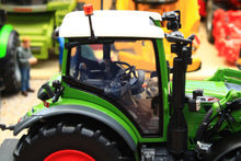 Load image into Gallery viewer, Close up of a green Fendt 516 Vario 4WD tractor model with front loader and detailed cab by Universal Hobbies in 1:32 scale