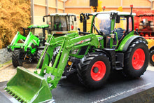 Load image into Gallery viewer, Universal Hobbies Fendt 516 Vario 4WD tractor model in green with front loader and bucket displayed in a detailed farm scene with another tractor behind it