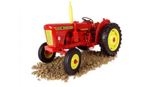 Load image into Gallery viewer, Universal Hobbies 1:16 scale David Brown 950 Implematic tractor model in red and yellow displayed on textured soil for farm dioramas