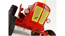 Load image into Gallery viewer, Close up of a red and yellow Universal Hobbies 1 16 scale tractor model showing the front grille headlights and large black tyres