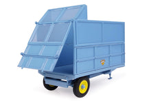 Load image into Gallery viewer, Universal Hobbies 1:32 scale blue Weeks silage trailer model with raised panels and yellow wheels for farm machinery layouts