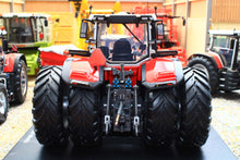 Load image into Gallery viewer, Universal Hobbies Massey Ferguson 9S.425 4WD tractor model in red with dual rear wheels rear linkage and enclosed cab on display