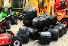 Load image into Gallery viewer, Universal Hobbies 1:32 scale black wrapped round silage bales arranged in a farm scene. Only the bales are included.