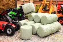 Load image into Gallery viewer, Universal Hobbies 1:32 scale green wrapped round silage bales stacked in a farm diorama with machinery in the background Only the bales are included