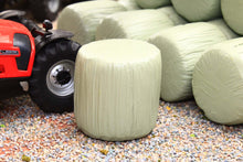Load image into Gallery viewer, Universal Hobbies 1:32 scale model of green wrapped round silage bales beside a red tractor, with only the bales included