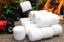 Load image into Gallery viewer, Universal Hobbies 1:32 scale model featuring 20 white wrapped round silage bales for farm dioramas Only the bales are included machinery shown is not included