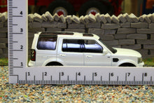 Load image into Gallery viewer, WHE640101 WHEELART 1:64 Scale Land Rover Discovery 4 in White with Silver Alloys
