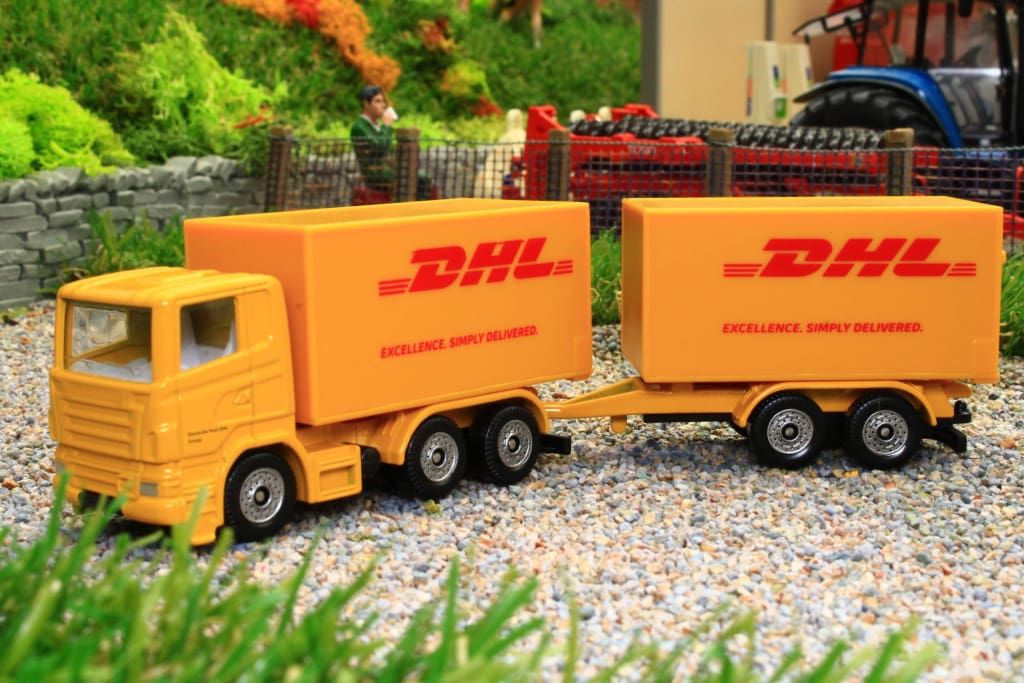 1694 Siku DHL Lorry with Trailer – Brushwood Toys
