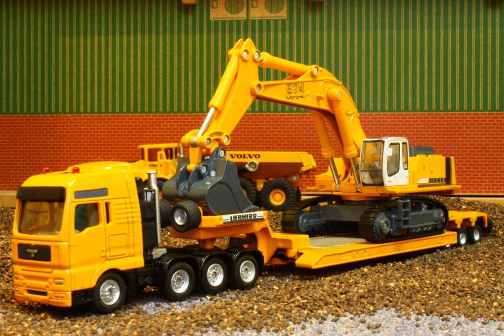 Siku 1/87 MAN Porte-Char + Pelleteuse Liebherr 974 – Réf 1847 – TBE