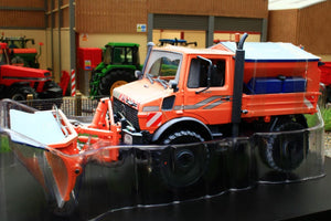 SCH07724 SCHUCO MERCEDES BENZ UNIMOG WITH SNOW PLOUGH AND SALT SPREADER - WINTER WEATHERED
